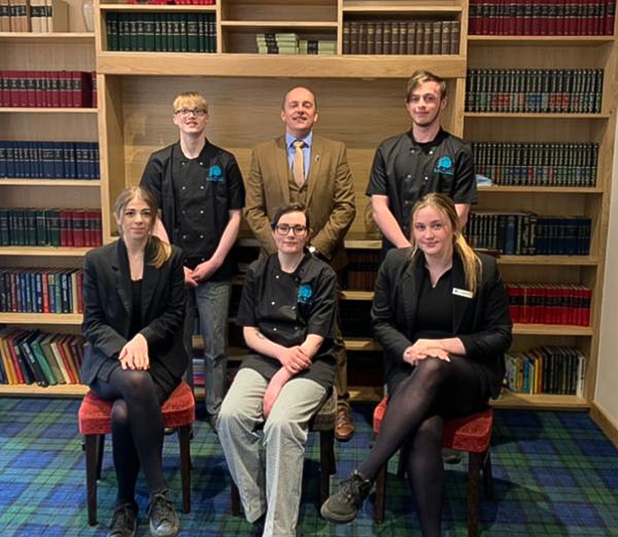 Andrew Mackay, owner of The Caithness Collection with modern apprentices at the Norseman Hotel