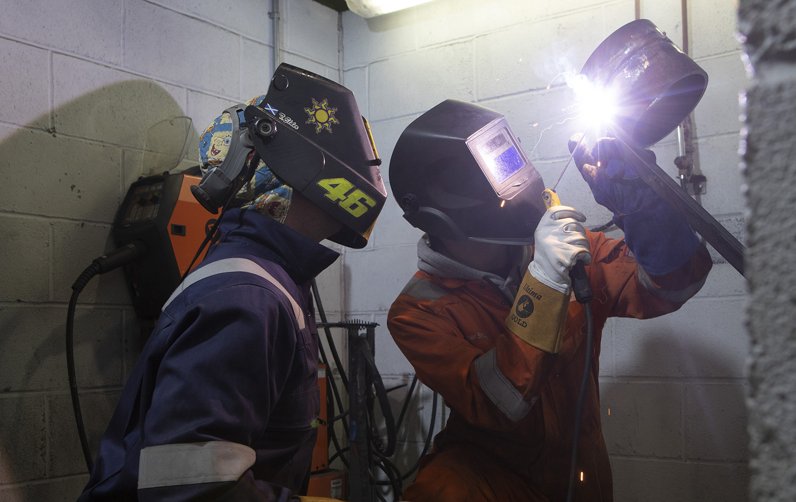 two engineering students carrying out welding work