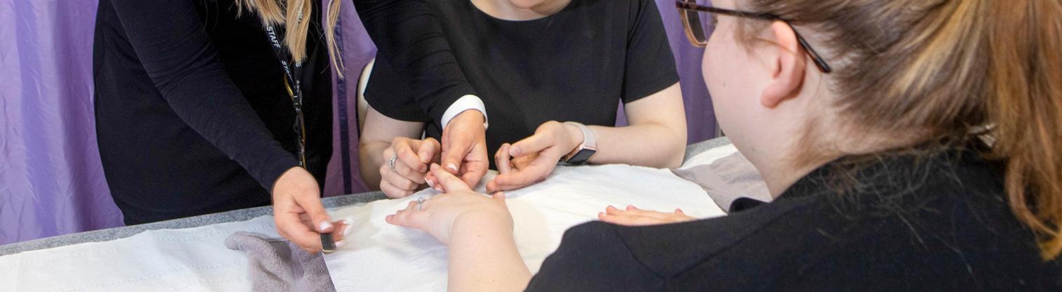 beauty student learning how to do nails