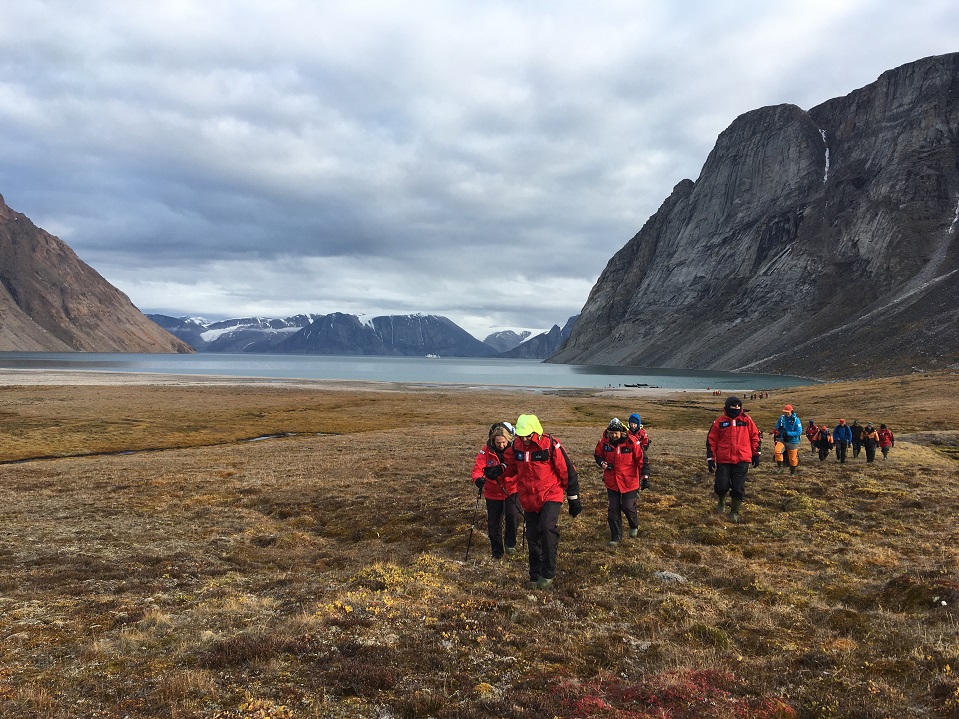 Tourists to Baffin, Canada. Mountain landscape, trail of people walking. Image by Dr Katie Murray CRTR