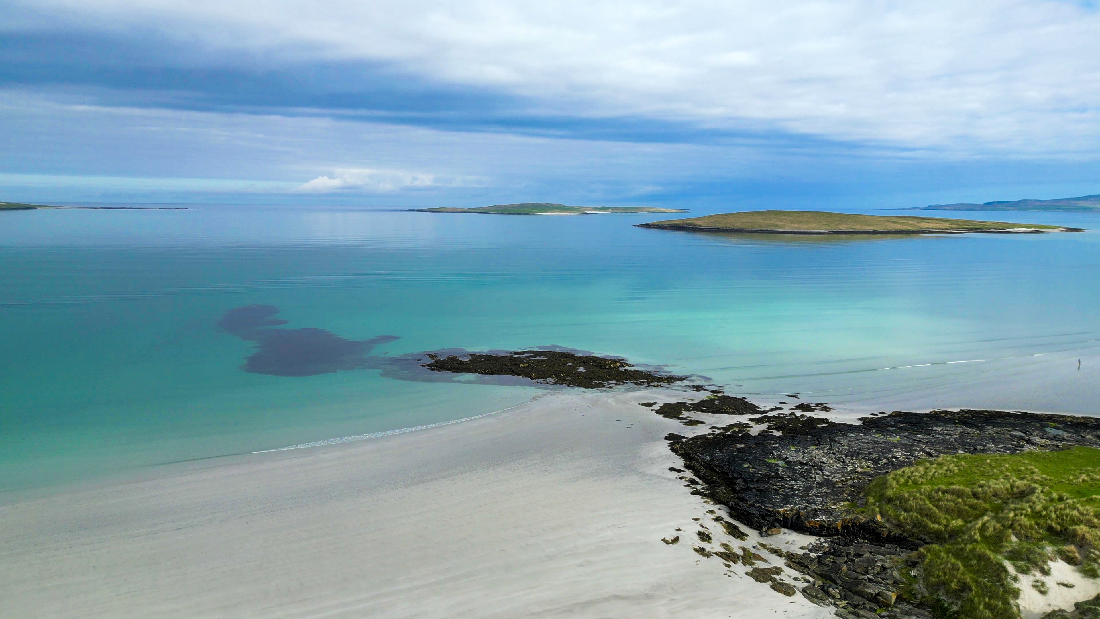 Aerial shot of a white sand beach with turquoise waters in the Outer Hebrides Aerial shot of a white sand beach with turquoise waters in the Outer Hebrides