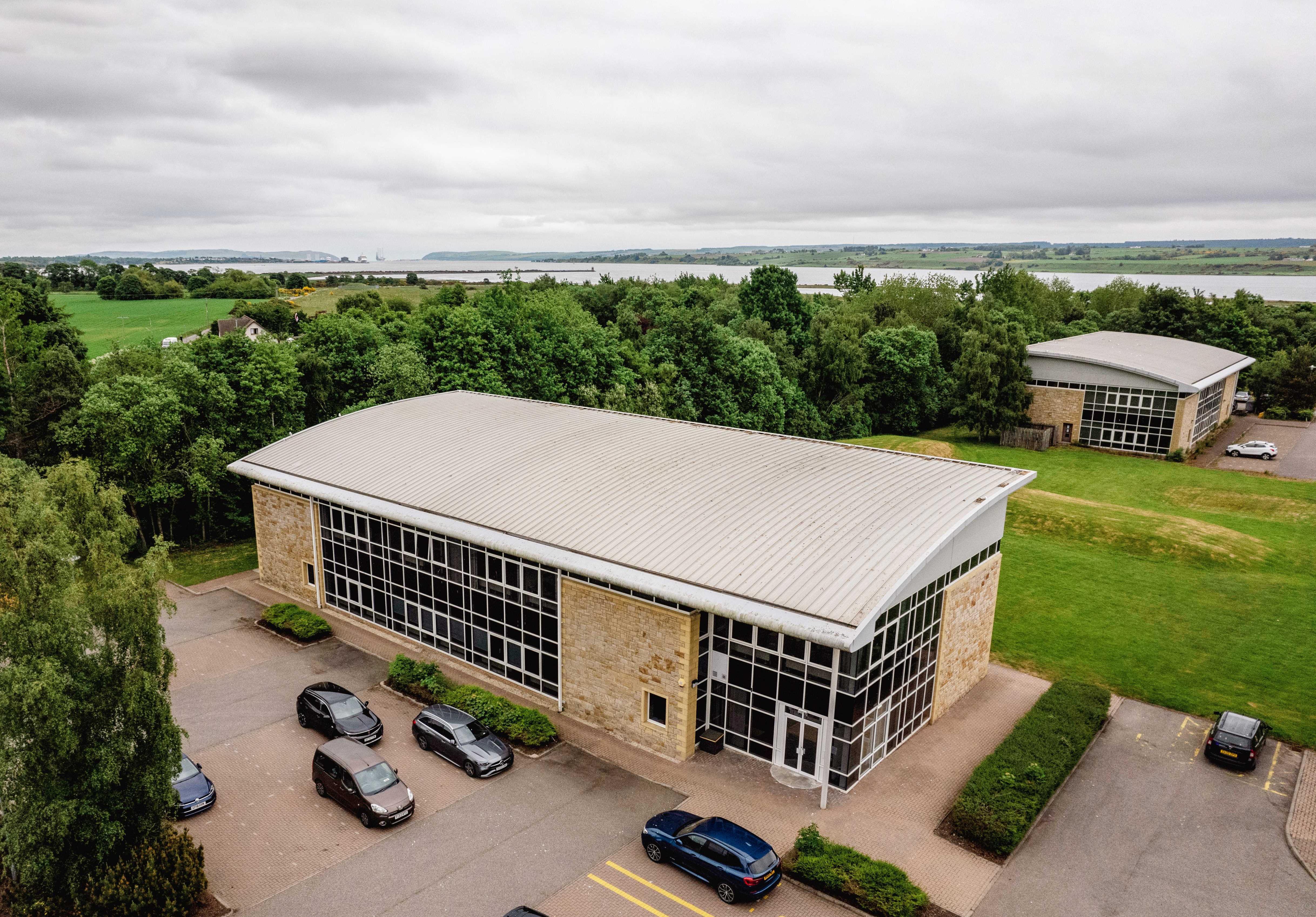 aerial image of Alness campus building with Cromarty firth in the background