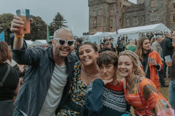 Group of people posing at a festival