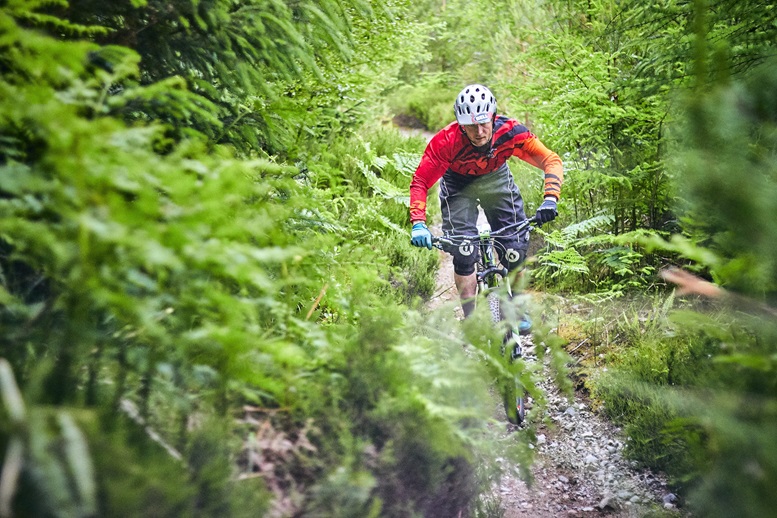 a student mountain biking a student mountain biking