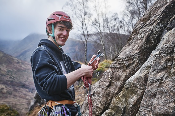 a student rock climbing