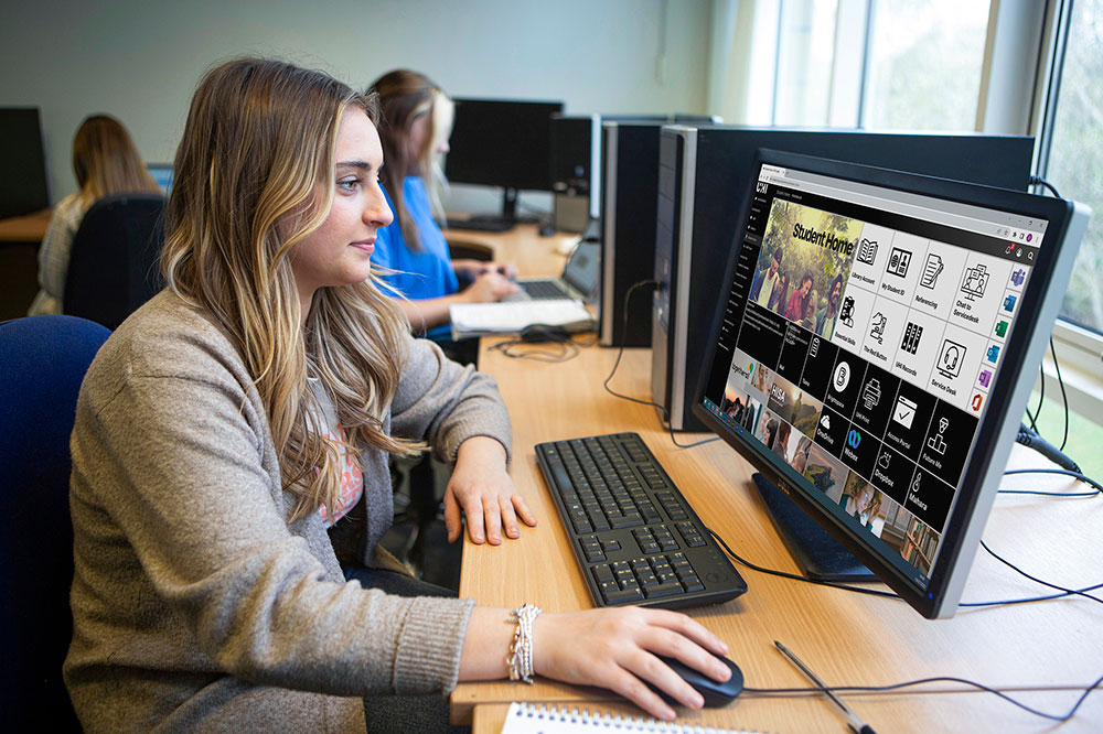 student working on computer