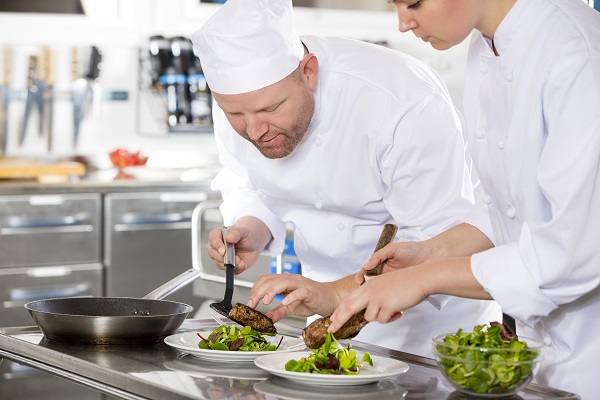 students plating the food