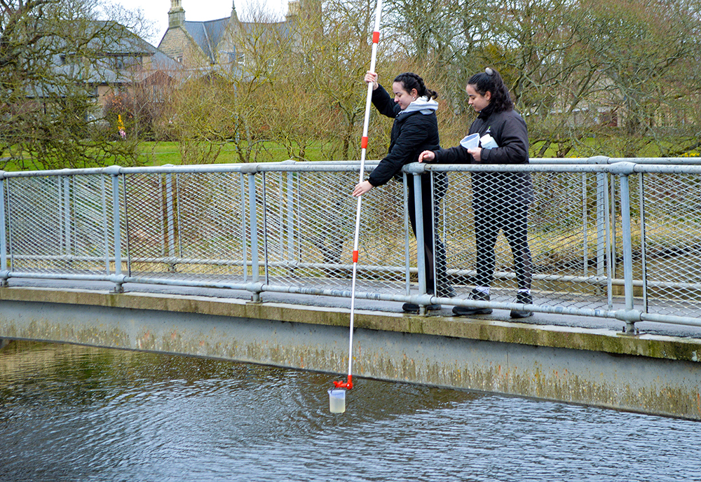 environmental students collecting water samples for thurso river