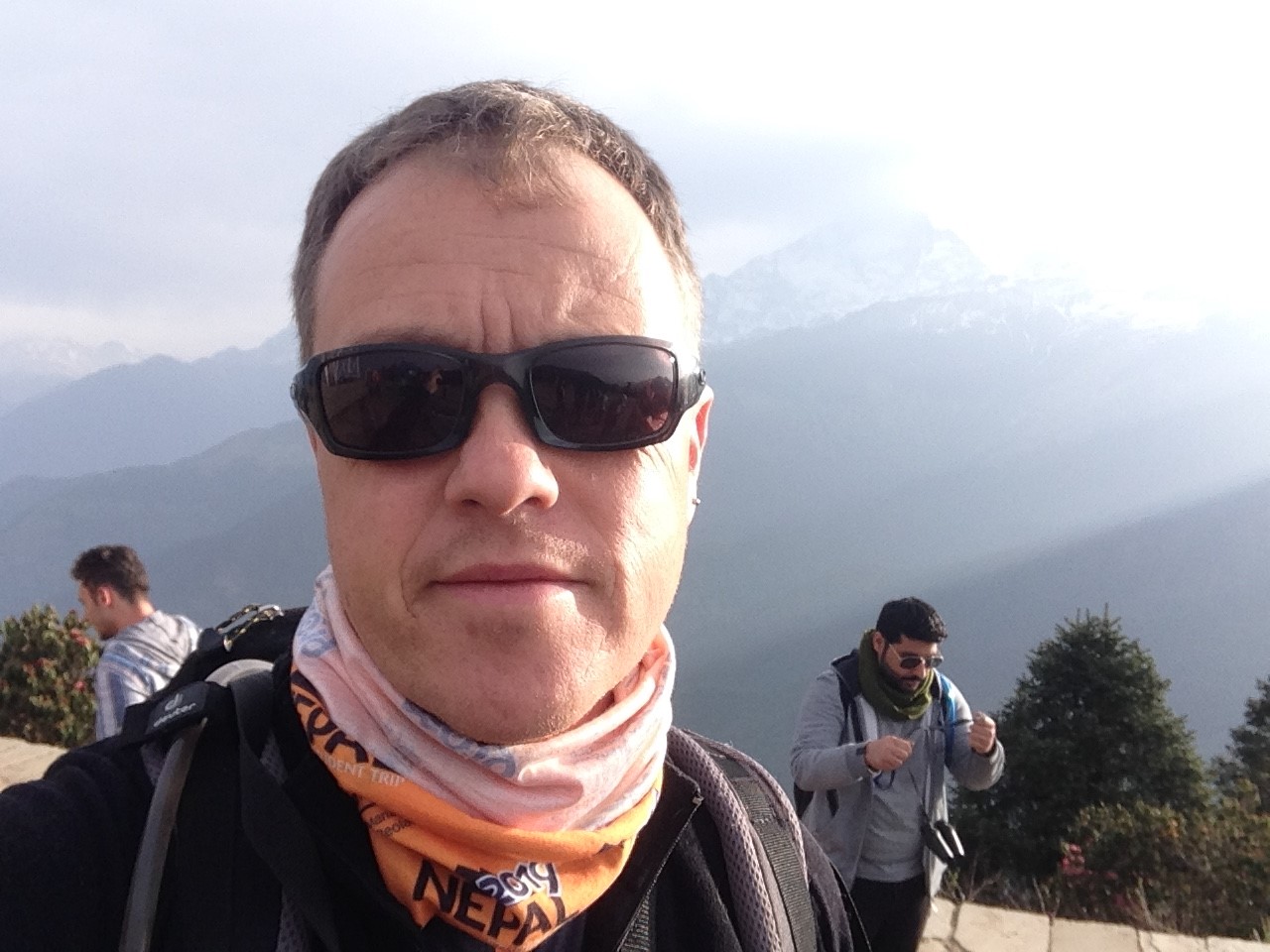 a selfie of Professor Carl Carter at the top of a mountain